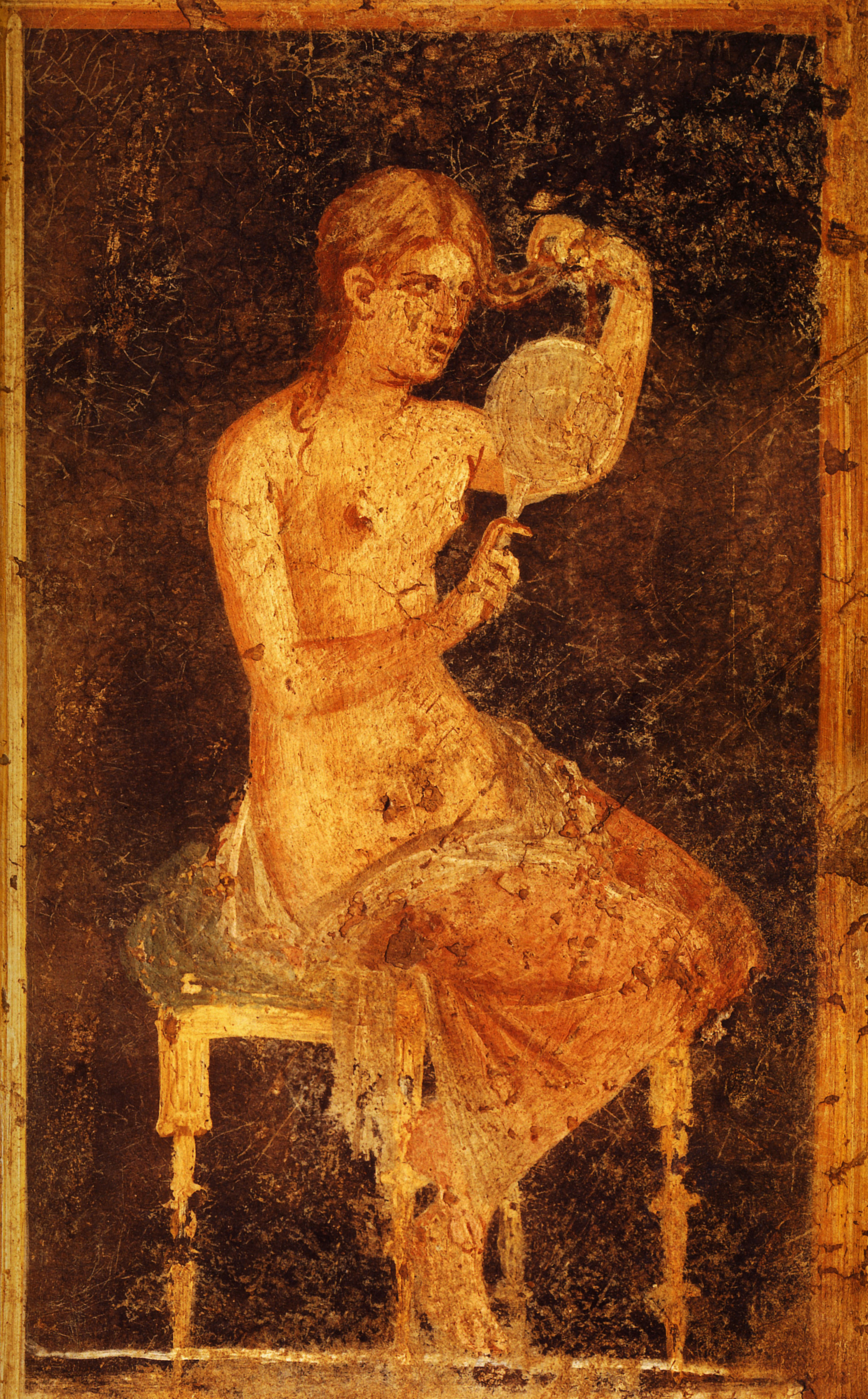 Young woman with a mirror